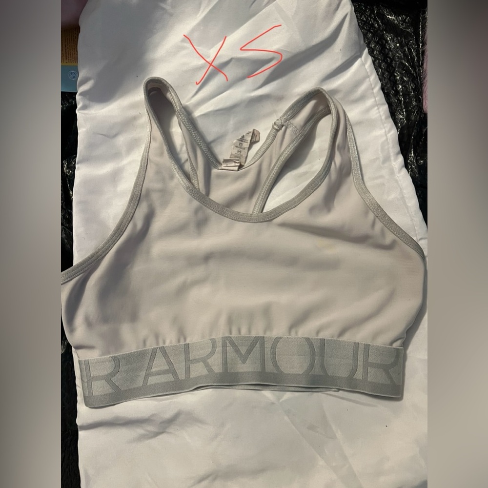 Five under armor sports bras 4 XS and one small